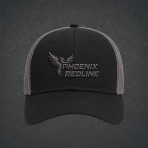 A dark gray trucker cap with a tonal gray embroidered Phoenix Redline logo on the front, set against a dark textured gray background.