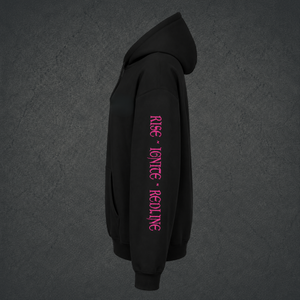 A black pullover hoodie shown from the side profile on a solid white background, featuring vertical pink text on the right sleeve reading 'RISE • IGNITE • REDLINE'.